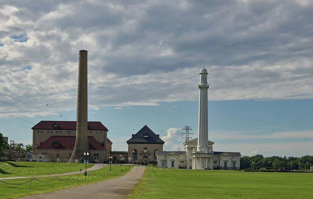 The ornate white Louisville Water Tower beside the historic pumping station.
