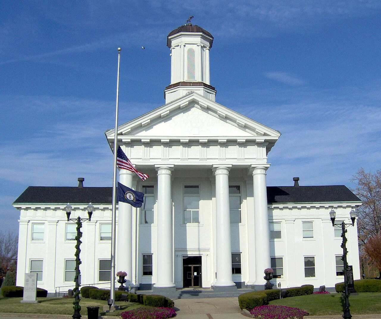 The white columned Madison County Courthouse beneath a blue sky in Richmond.