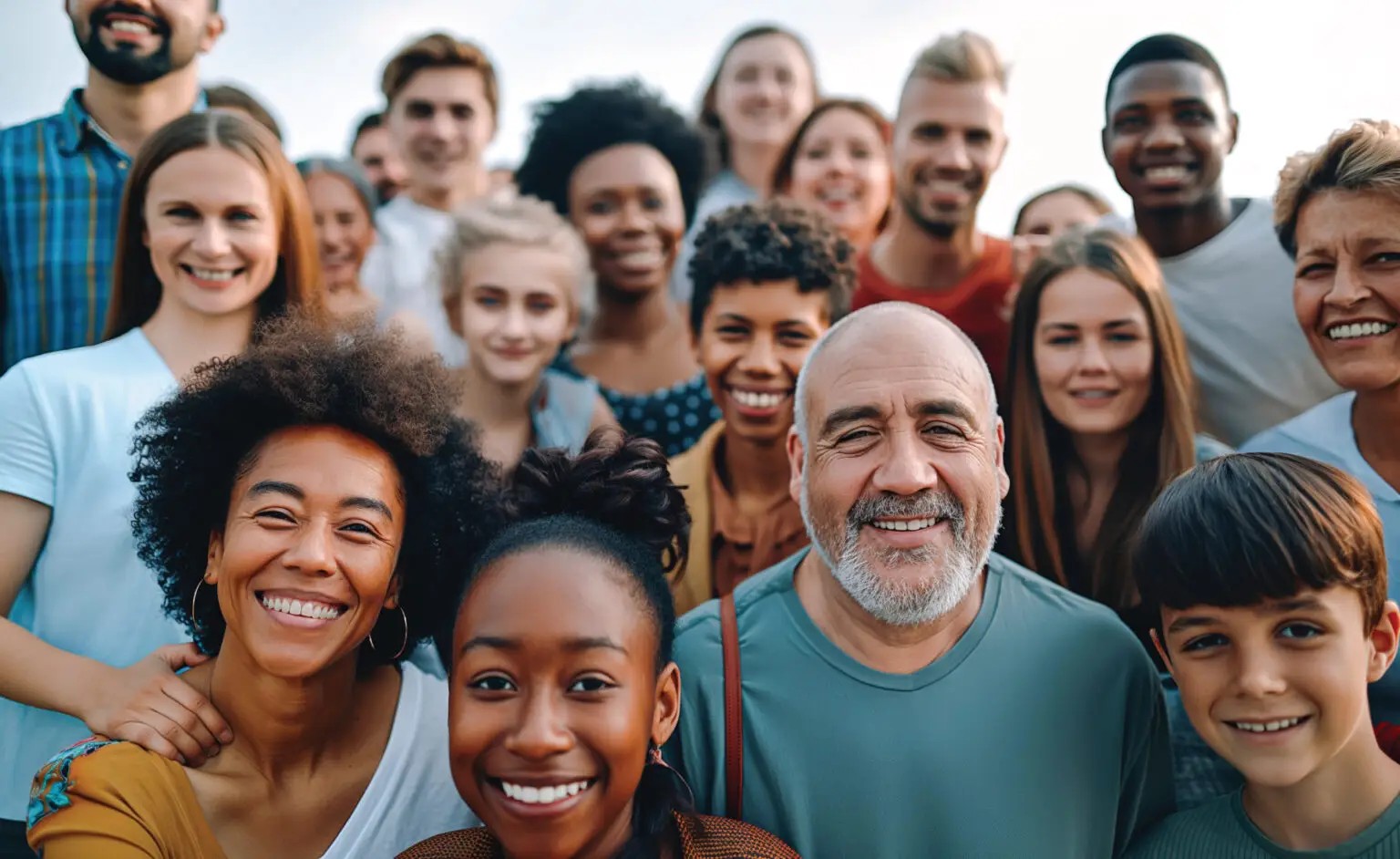 A smiling multigenerational group of adults and children